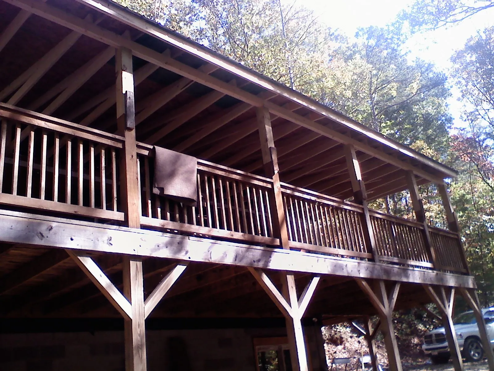 Timber framing under a new elevated porch and deck — Roof Leak Repair in New Braintree by Roofing Brothers